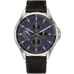 Embrace a unique, modern look with this original Tommy Hilfiger watch. This authentic timepiece, reference 1791616 (Shawn model), features a striking blue dial and a sleek black genuine leather strap.