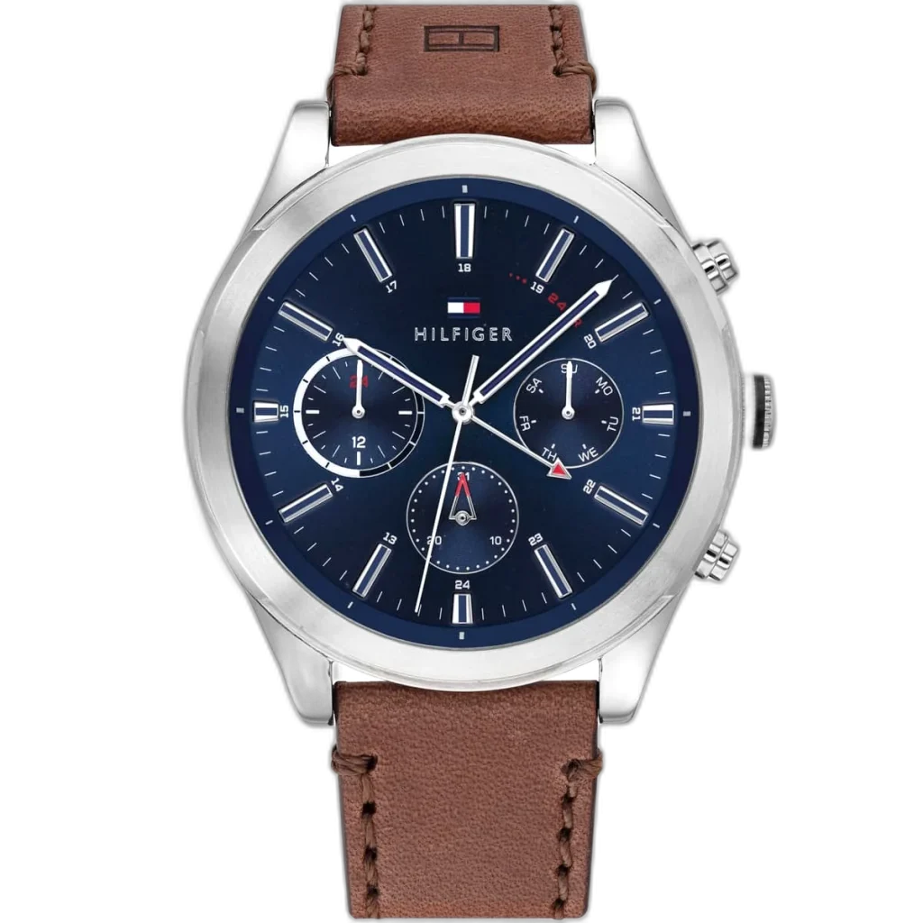 Embrace a sophisticated look with this original Tommy Hilfiger watch. This authentic timepiece, reference 1791741 (Ashton model), features a striking blue dial and a classic brown genuine leather strap.