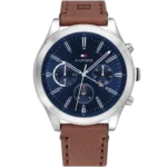 Embrace a sophisticated look with this original Tommy Hilfiger watch. This authentic timepiece, reference 1791741 (Ashton model), features a striking blue dial and a classic brown genuine leather strap.