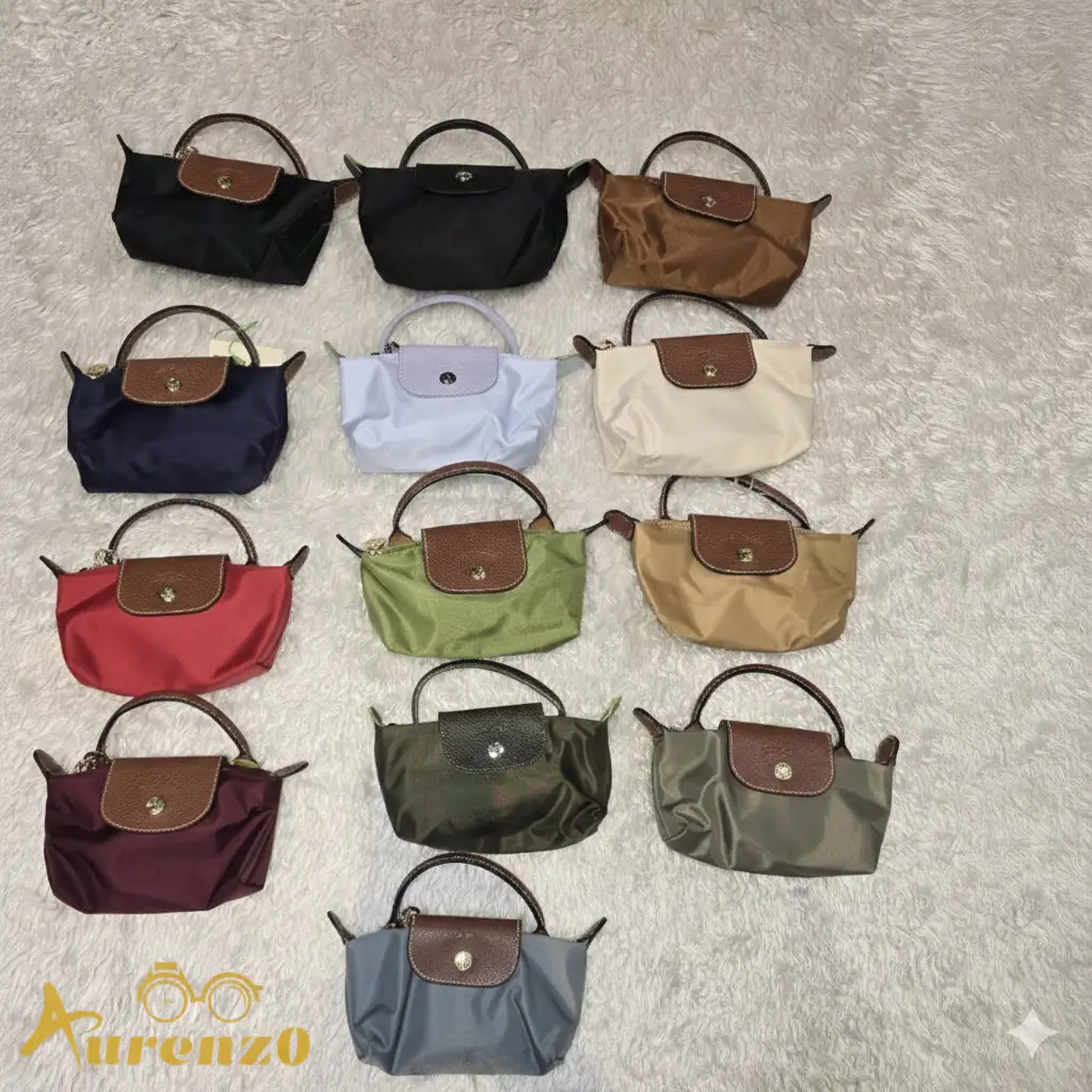 Longchamp Mini Pouch Bag (Le Pliage style), Blue Nylon Canvas body with Brown leather flap and top handle, gold-tone snap closure, and detachable crossbody strap.