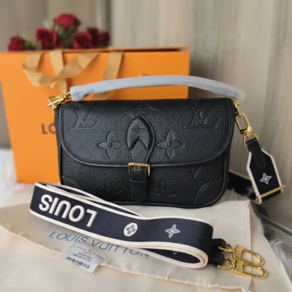 Louis Vuitton Flap Shoulder Bag (Pochette Métis style) in Black Monogram Empreinte leather, with single top handle, wide branded canvas strap, and gold-tone hardware/buckle closure.
