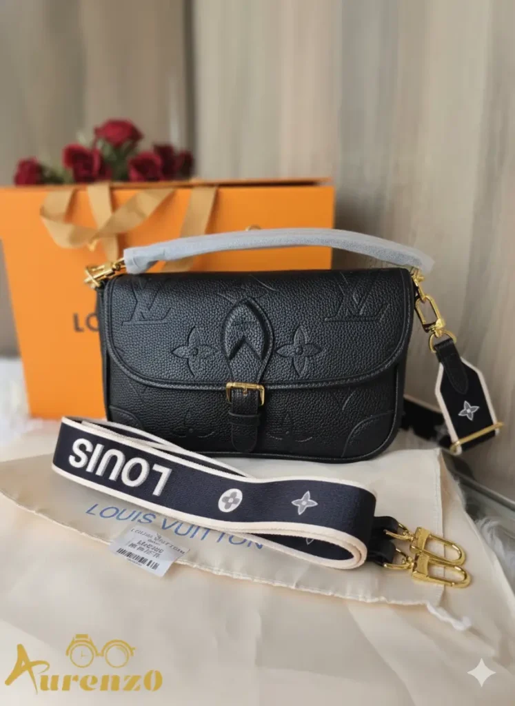 Louis Vuitton Flap Shoulder Bag (Pochette Métis style) in Black Monogram Empreinte leather, with single top handle, wide branded canvas strap, and gold-tone hardware/buckle closure.