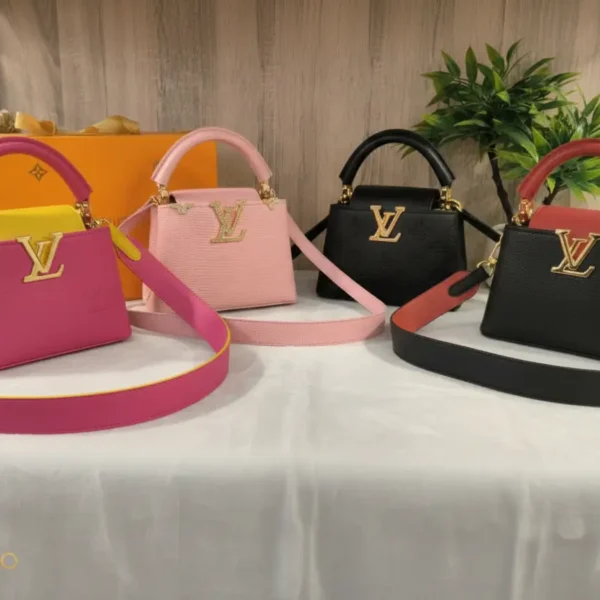 Louis Vuitton Structured Mini Handbag, available in multiple colors (Black, Red, Pink, Fuchsia), featuring prominent gold-tone LV logo, wide detachable strap, and single top handle.