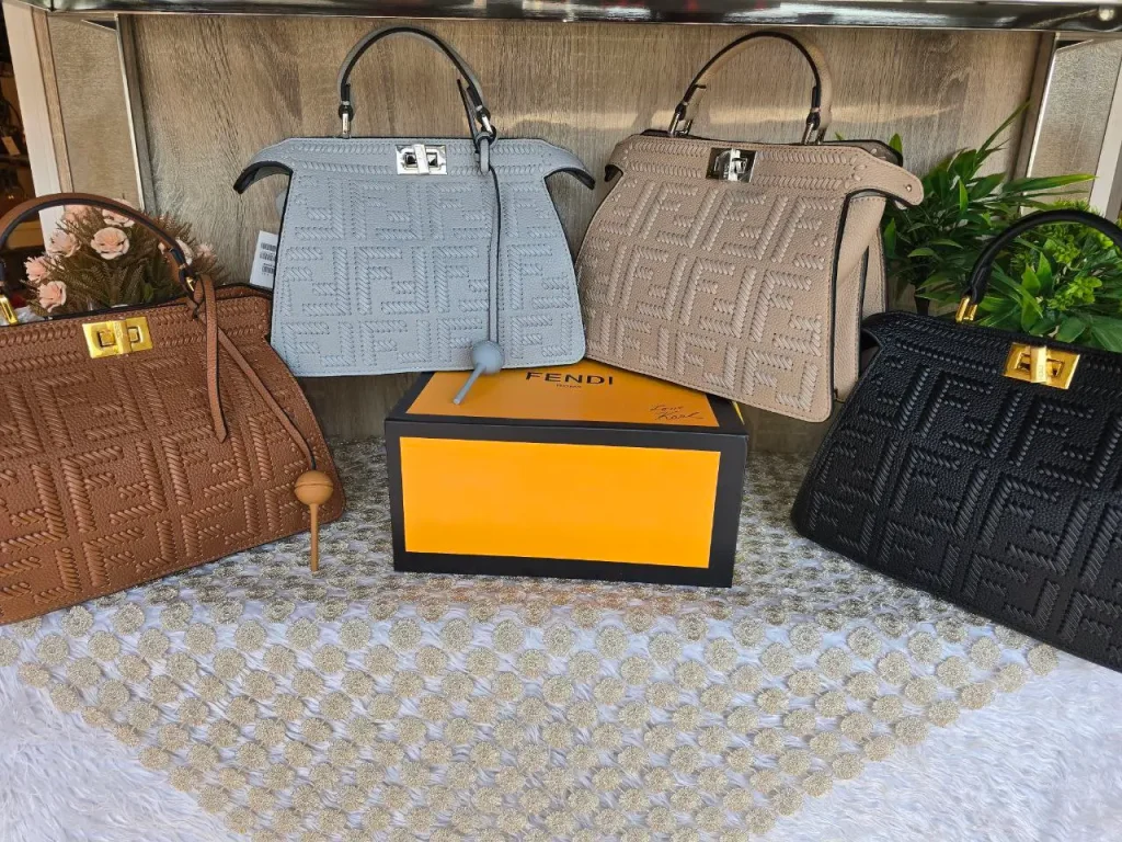 Fendi Peekaboo ISeeU Defender Handbag, premium leather with embossed FF logo and Intrecciato weave texture, top handle, iconic metallic turn-lock closure.