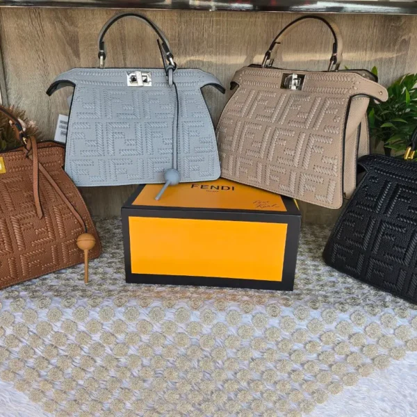 Fendi Peekaboo ISeeU Defender Handbag, premium leather with embossed FF logo and Intrecciato weave texture, top handle, iconic metallic turn-lock closure.