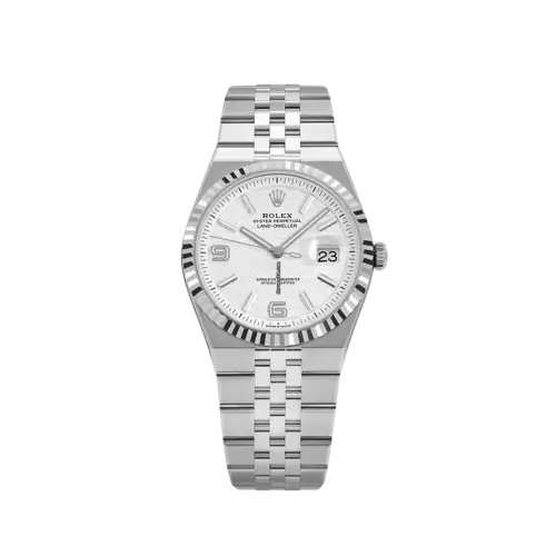 Master the Terrain with the 2025 Rolex Land-Dweller 127334 The Rolex Land-Dweller is the newest chapter in Rolex’s legacy of professional watches. While the Sea-Dweller conquered the depths and the Sky-Dweller mastered the heavens, the Rolex Land-Dweller is purpose-built for the terrestrial pioneer. The 127334 model, released in 2025, introduces a refined aesthetic that balances rugged durability with a sophisticated "Intense White" finish. Carrying a Rolex Land-Dweller on your wrist is a testament to your pursuit of precision, regardless of the challenges the terrain may hold. Advanced Engineering for the 2025 Terrestrial Explorer Intense White Dial Perfection: The hallmark of this Rolex Land-Dweller is its high-definition "Intense White" dial, offering a clean, crisp backdrop for the Chromalight indices that glow blue in low-light conditions. 904L Oystersteel Durability: Every Rolex Land-Dweller is forged from Rolex’s proprietary 904L steel, ensuring exceptional resistance to corrosion and a mirror-like polish that stands the test of time. Calibre 3335 Movement: At the heart of the Rolex Land-Dweller lies the new-generation Calibre 3335, a self-winding mechanical movement that offers a 72-hour power reserve and unparalleled magnetic resistance. The Iconic Fluted Bezel: This Rolex Land-Dweller features a white gold fluted bezel that catches the light brilliantly, adding a touch of prestige to its professional architecture. Jubilee or Oyster Bracelet Options: The 2025 Rolex Land-Dweller comes with an updated Jubilee bracelet, featuring the Easylink extension system for maximum comfort during temperature changes. Why the Rolex Land-Dweller 127334 is the Future of Luxury Tools Rolex Land-Dweller: 2025 model 127334 with intense white dial, stainless steel jubilee bracelet, and white gold fluted bezel.