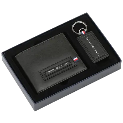 Tommy Hilfiger men's gift set, black leather bifold wallet with logo plaque, matching leather keychain with metal ring, signature gift box presentation.