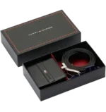 Tommy Hilfiger men's gift set in box, black leather bifold wallet with logo, reversible double-face belt (black and brown), metallic buckle, white contrast stitching.