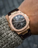 Patek Philippe Nautilus: 5712R-001 18K rose gold watch with moon phase, black-brown dial, and brown alligator leather strap.