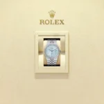 "5 Breathtaking views of the iconic Rolex Land-Dweller Watch with Tiffany Blue honeycomb dial and silver stainless steel strap, showcasing its modern luxury design."