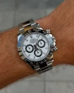 "7 Incredible angles of the legendary Rolex Daytona Watch with white dial and silver stainless steel strap, highlighting its Japanese automatic movement and Swiss design."