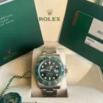"5 Breathtaking views of the iconic Rolex Submariner Watch in silver stainless steel, featuring the incredible green dial and 41mm mirror original design."