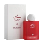 breathtaking view of the iconic Musk Abaq Al-Rumman Perfume 75ml bottle next to its legendary white luxury packaging box featuring traditional patterns."