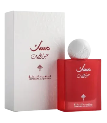breathtaking view of the iconic Musk Abaq Al-Rumman Perfume 75ml bottle next to its legendary white luxury packaging box featuring traditional patterns."